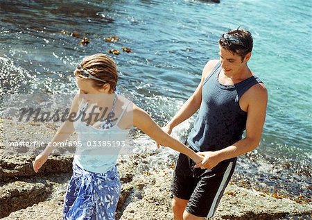 Young couple at water's edge, high angle view