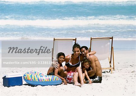 Family posing for photo on beach