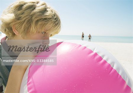 Boy blowing up beach ball at beach - Stock Photo - Masterfile - Premium  Royalty-Free, Code: 695-03388585