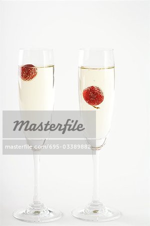 Champagne with cherries in glasses