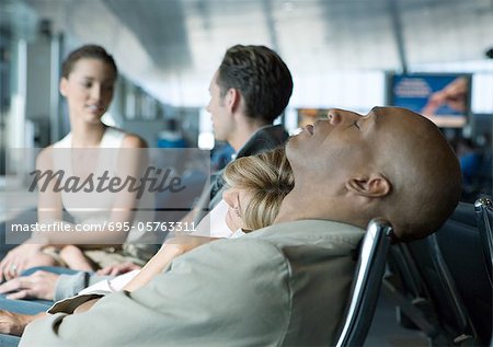 People in airport lounge