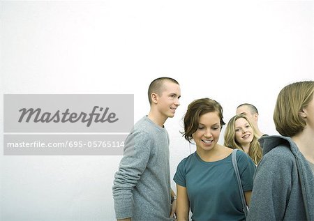 Group of young adult and teenage friends, white background