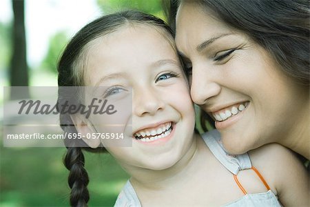 Girl and mother, laughing, close-up