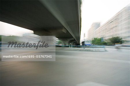 Overpass viewed from freeway, blurred motion