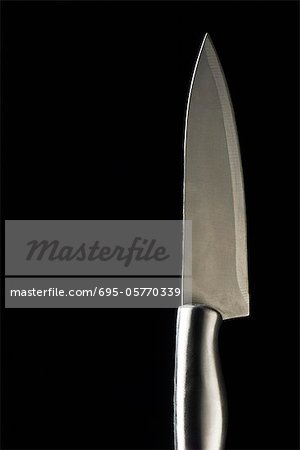Chef's knife on black background