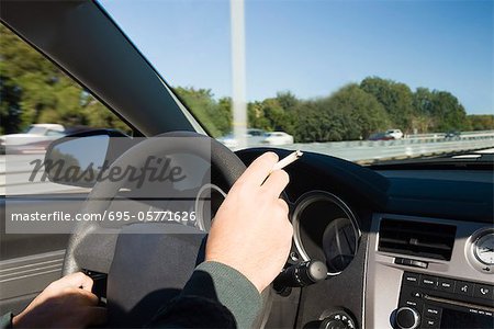 Smoking a cigarette while driving