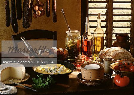 Table spread with various foods and cooking ingredients