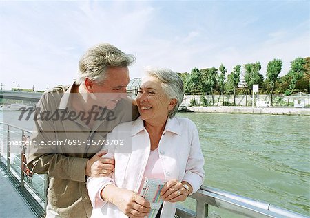 France, Paris, mature man and woman on a boat in the River Seine