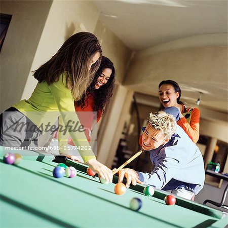 Family playing pool