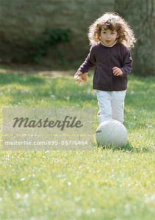 Child playing with soccer ball