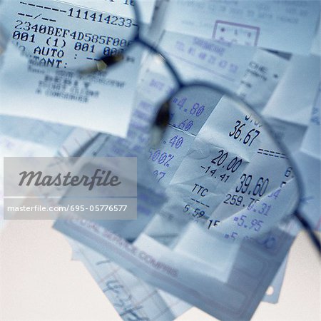 Sales receipts viewed through glasses