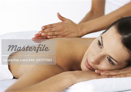Woman massaging second woman on massage table