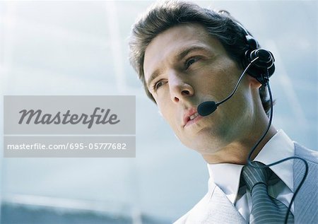 Man With Headset Low Angle Shot Stock Photo Masterfile