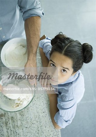 Father and daughter cooking together