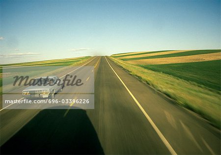 Birds eye view of road through rural landscape