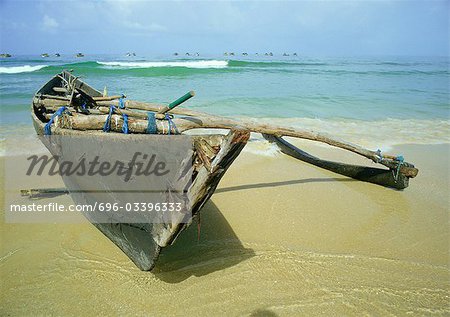 Dugout canoe on beach, India