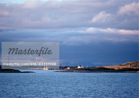 Norway, houses on edge of sea in distance