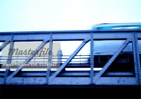 France, Paris, elevated train and eiffel tower in background, blurry. France, Paris, elevated train and eiffel tower in background, blurry.