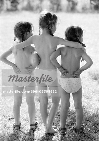 Three small girls standing outside in underwear, rear view, b&w - Stock  Photo - Masterfile - Premium Royalty-Free, Code: 696-03398682