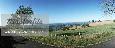 France, country road along fields, panoramic view