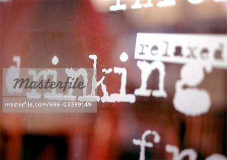 Relaxed, drinking text on window, close-up