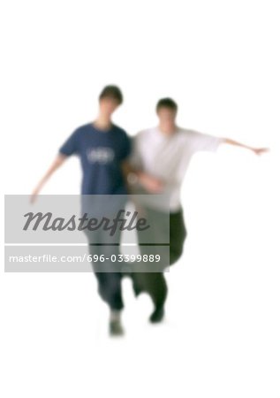 Silhouette of two men arm in arm, on white background, defocused