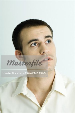 Man looking away, head and shoulders, portrait