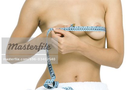 Premium Photo  Woman hand and closeup of breast with measuring