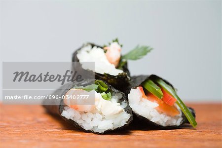 Three temaki sushi, stacked, close-up