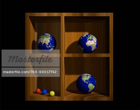 Three Globes on a Shelf Displaying Continents of the World