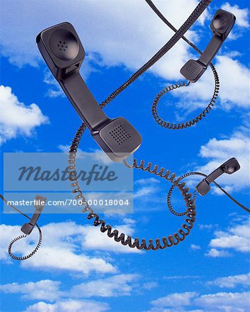 Telephone Receivers in Sky with Clouds