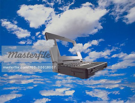 Laptop Computer in Sky with Clouds