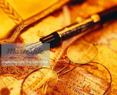 Fountain Pen and Eyeglasses on Antique Map