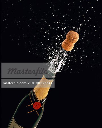 Cork Popping Out Of Champagne Bottle Stock Photo Masterfile