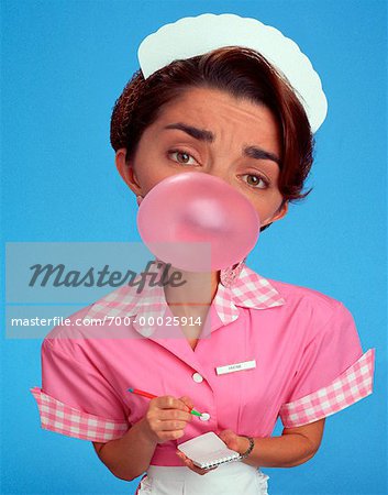 Portrait of Waitress Blowing Bubble Gum - Stock Photo - Masterfile