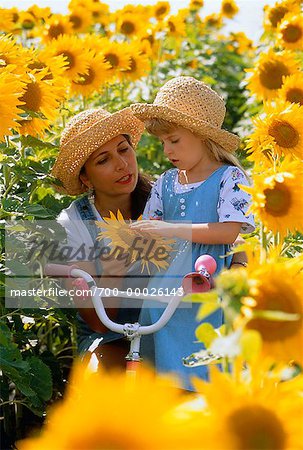 Mother and Daughter in Sunflower Field, Beauseajour, Manitoba Canada
