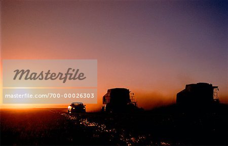 Combines at Sunset