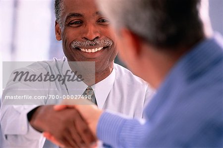 Mature Businessmen Shaking Hands