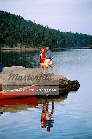 Portrait of Couple Standing on Rock near Canoe Temagami, Ontario, Canada