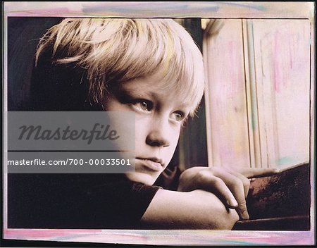Boy Looking Out Window