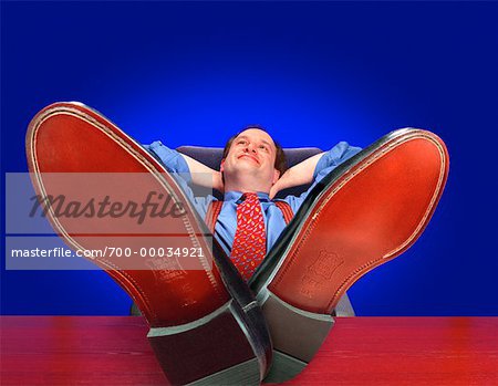 Businessman with Feet on Desk