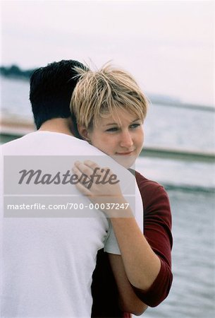 Couple Embracing by Water