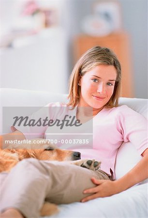 Portrait of Woman Sitting on Sofa With Dog