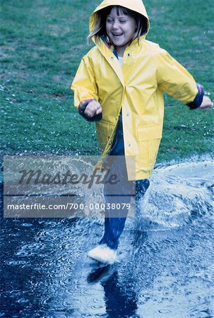 Girl Playing in Puddle