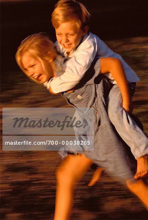 boy carrying girl