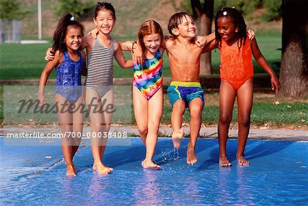 Little girl and boy in swimming suits holding swimming pads Stock Photo