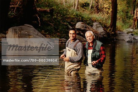 Mature Father and Son Fly Fishing Oak Creek Canyon, Arizona, USA