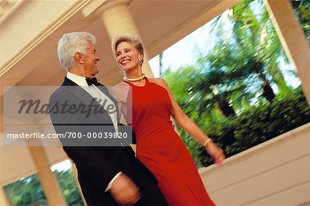 Mature Couple in Formal Wear Walking Outdoors