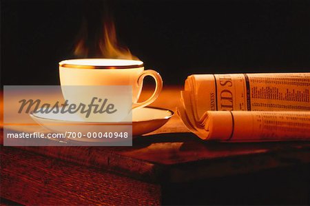 Coffee Cup and Financial Pages