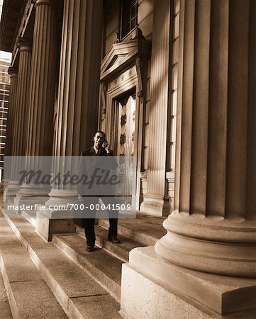 Businessman Using Cell Phone Outdoors